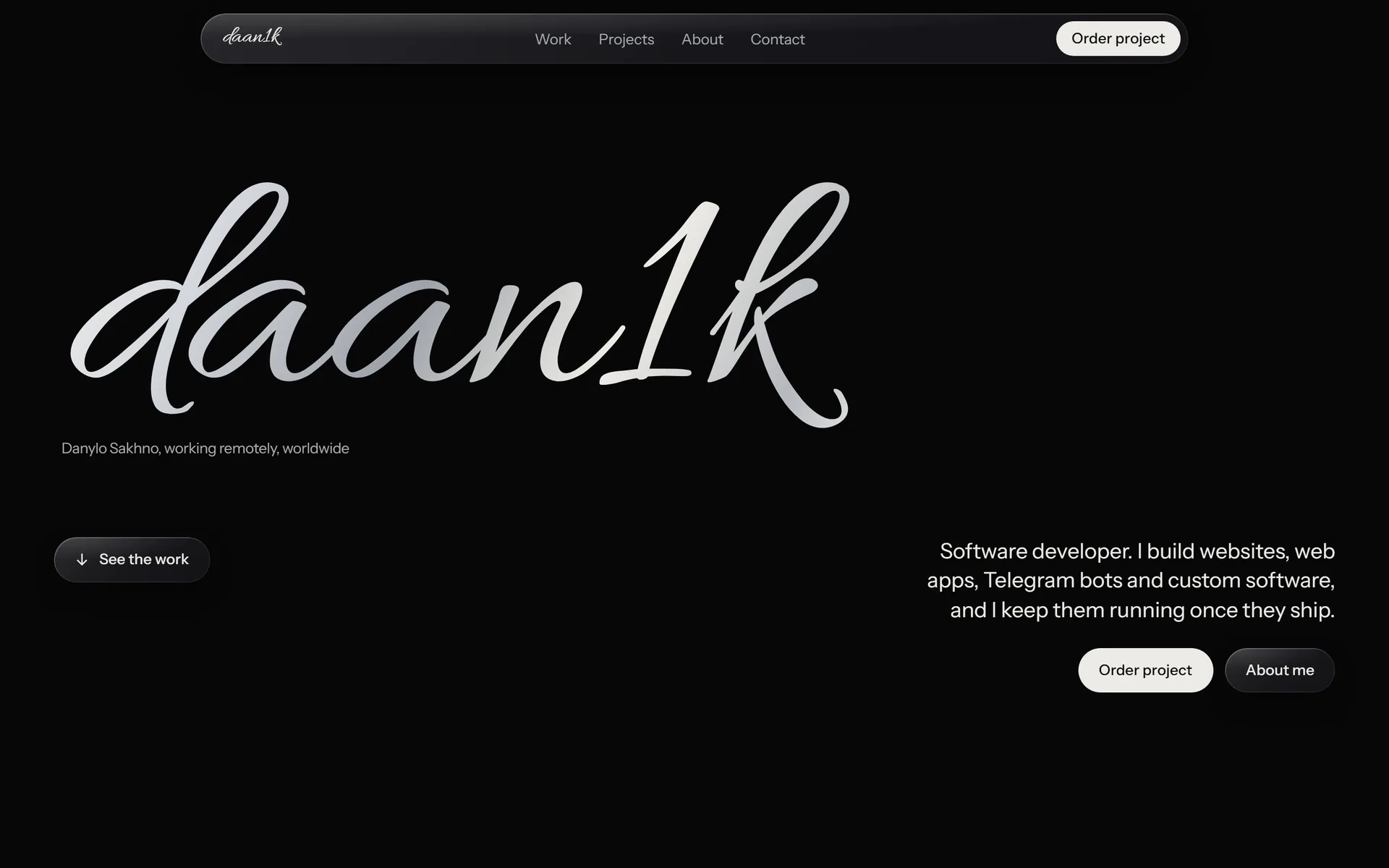 daan1k portfolio website: black background with a large silver script wordmark reading daan1k and the line "Danylo Sakhno, working remotely, worldwide".